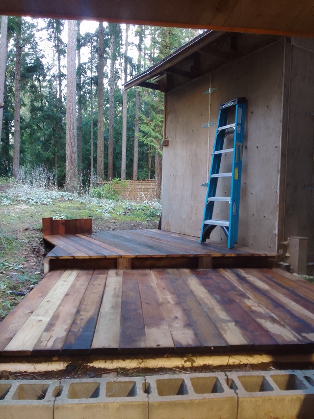 Wooden deck or patio built to create sufficient workspace to rip 20 foot slabs.