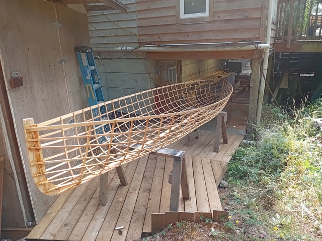 Picture of boat right side up on saw horses after lashing was complete